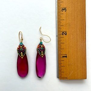 Miguel Ases deep pink drop earrings.